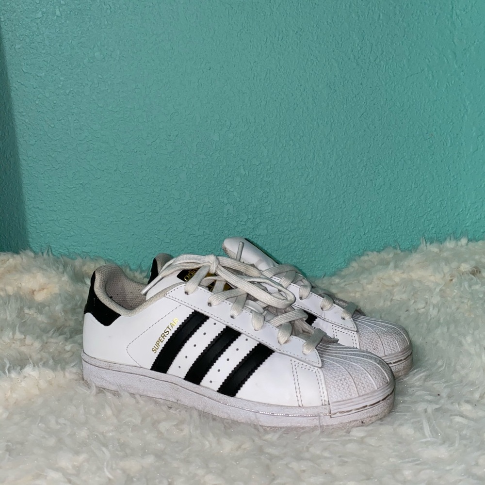 Adidas superstar shoes.